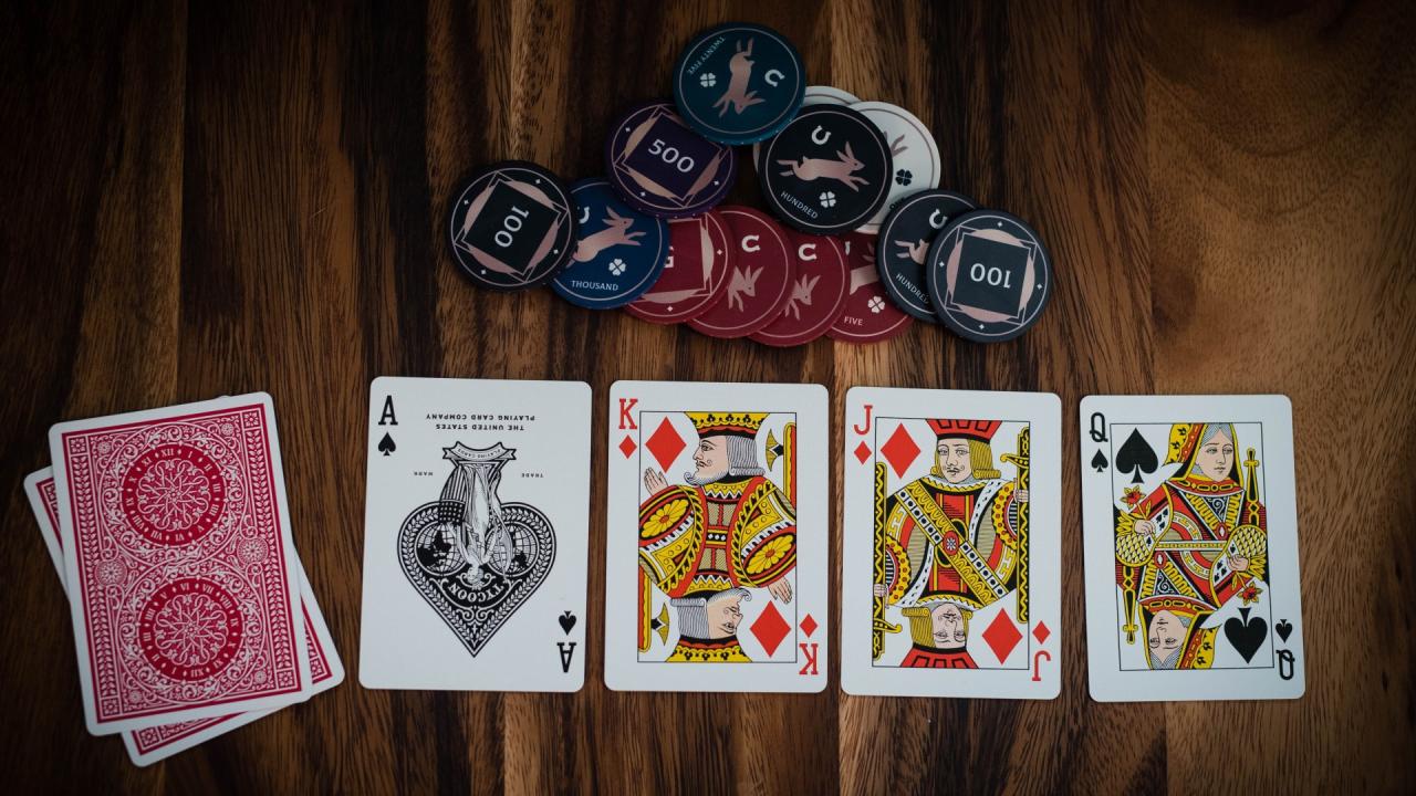 Poker rules how to play poker a pair of kings being thrown into the air, credit to Unsplash Michał Parzuchowski